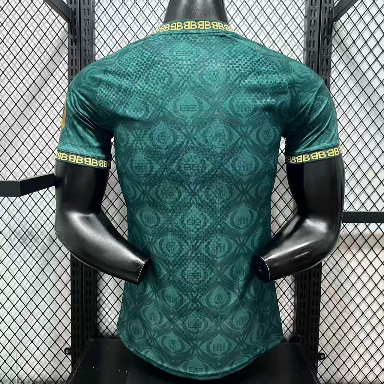 Back view of teal Real Madrid jersey with pattern and logo