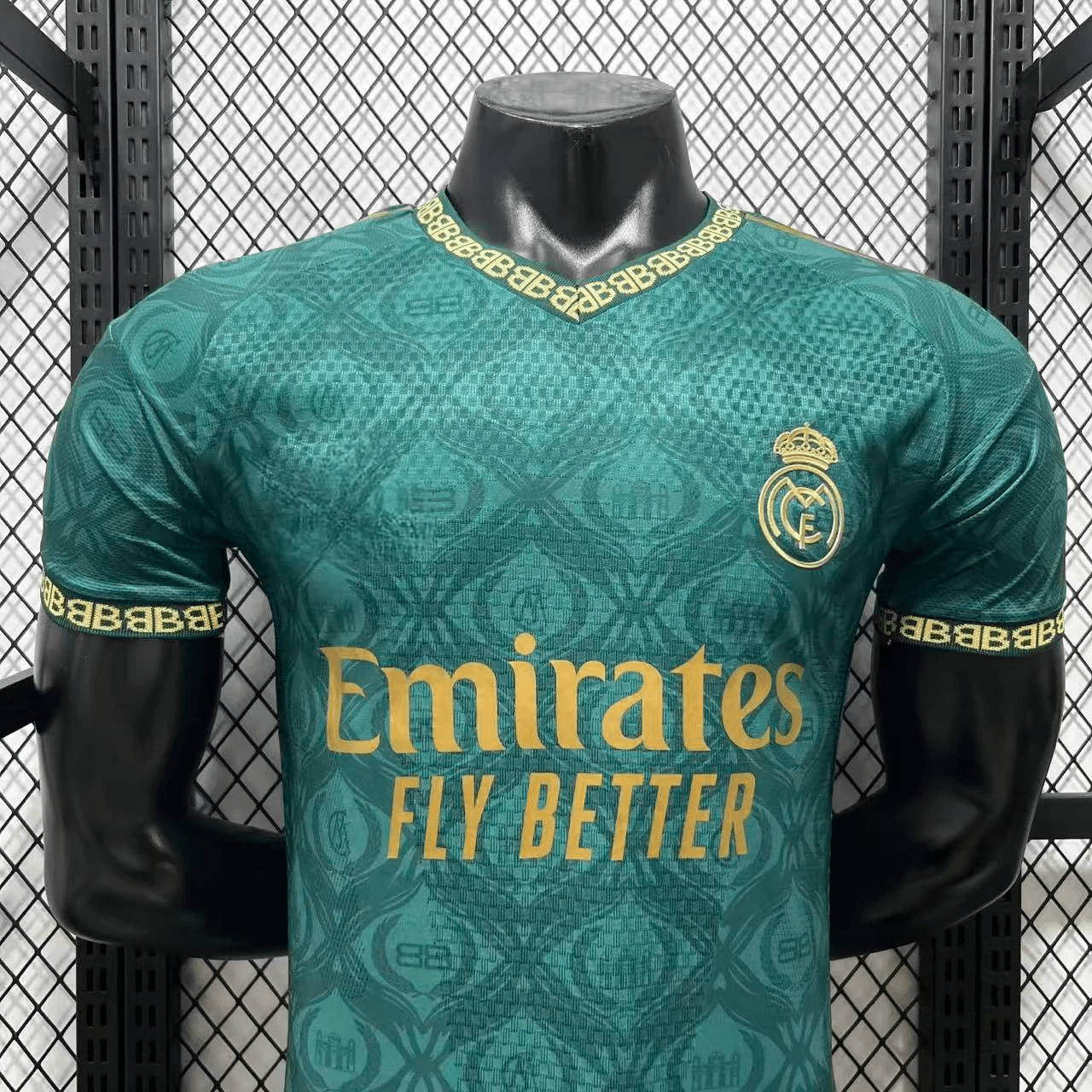 Front view of teal Real Madrid jersey with sponsor and crest